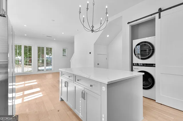 a kitchen with a stove a sink and a refrigerator