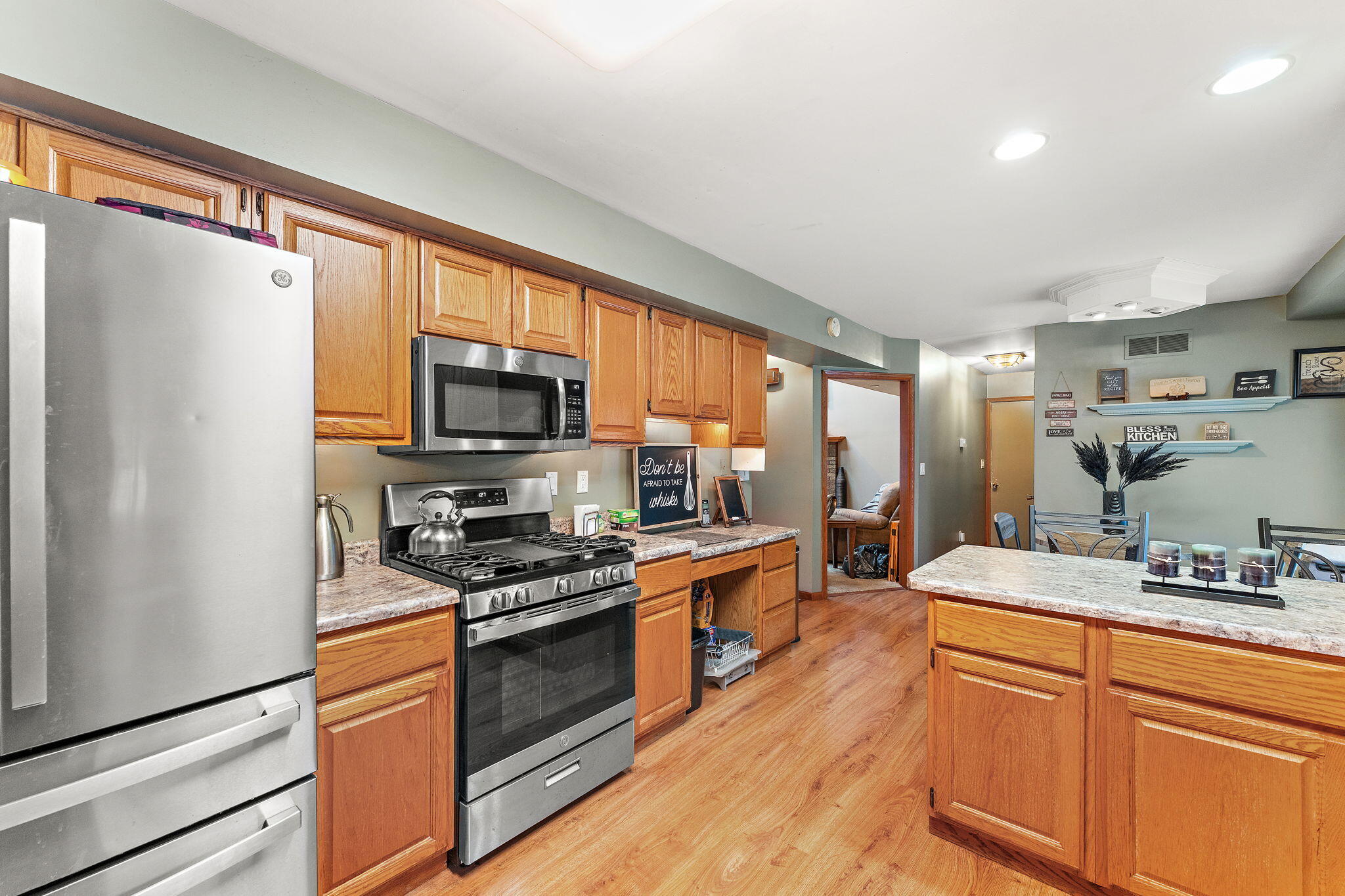 602 Brunswick Court Valparaiso, IN 46383 - Photo 9 of 34 a kitchen with stainless steel appliances granite countertop a refrigerator stove microwave and sink