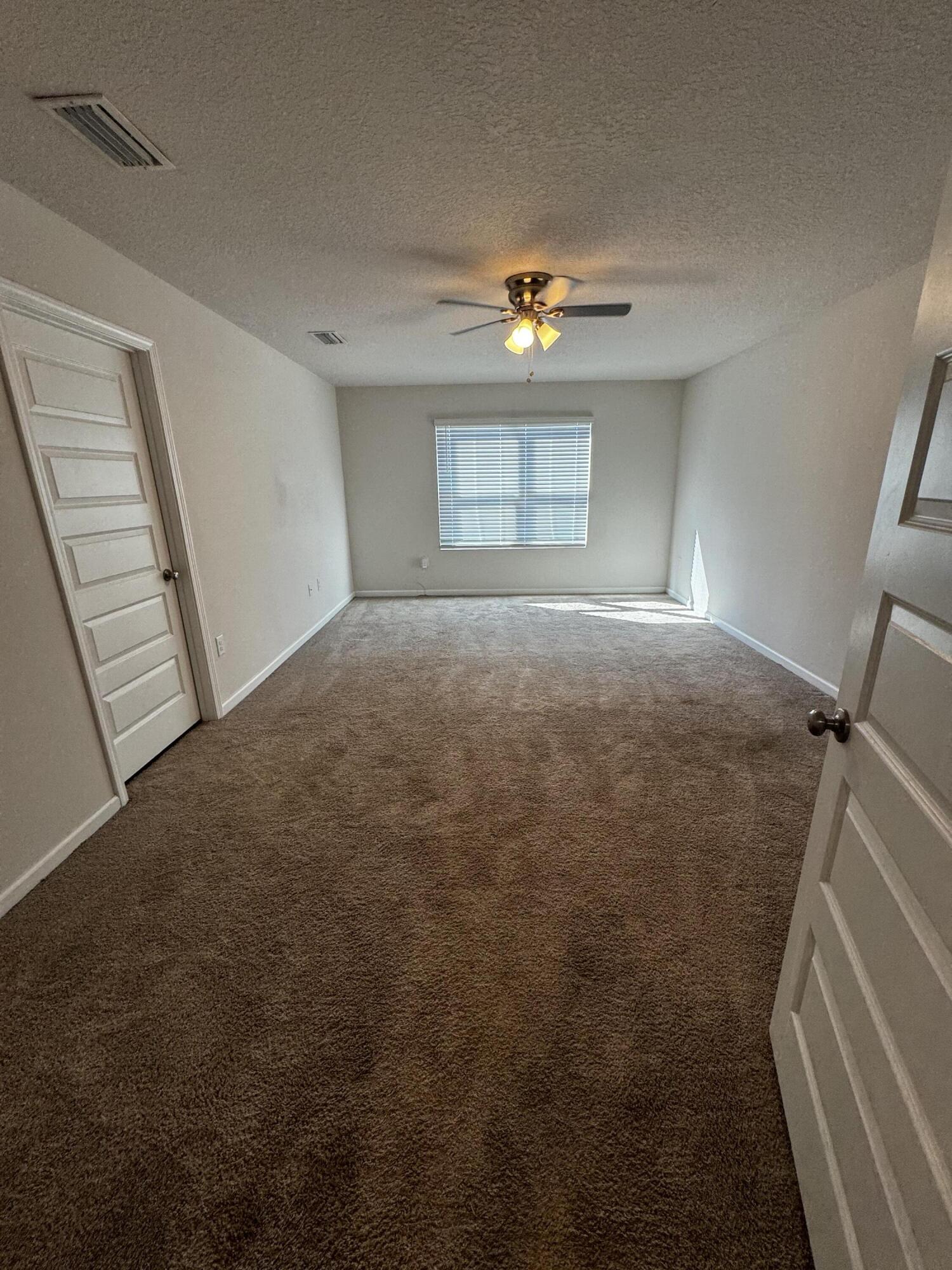 5444 Merlin Way Milton, FL 32583 - Photo 13 of 20 a view of an empty room and a window