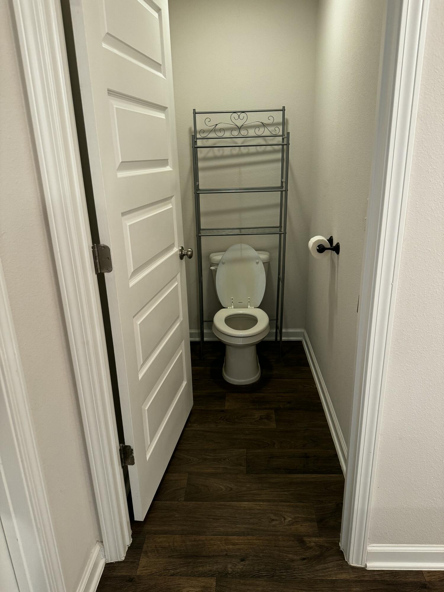 5444 Merlin Way Milton, FL 32583 - Photo 14 of 20 a bathroom with a toilet and a sink