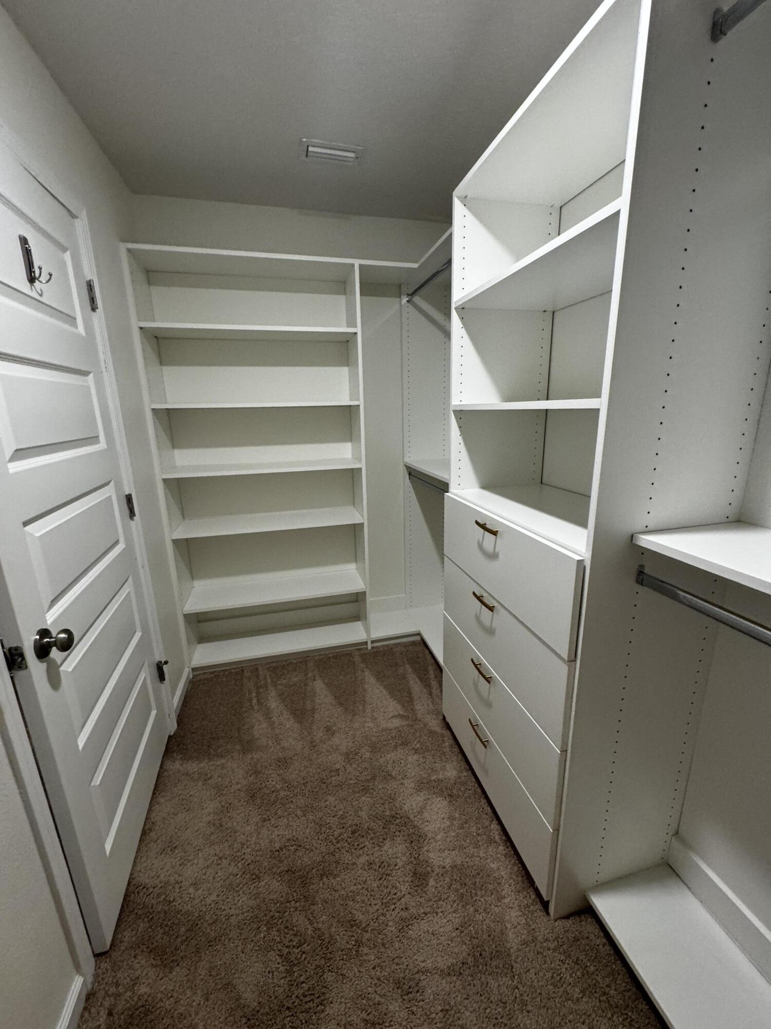 5444 Merlin Way Milton, FL 32583 - Photo 17 of 20 a view of an empty walk in closet