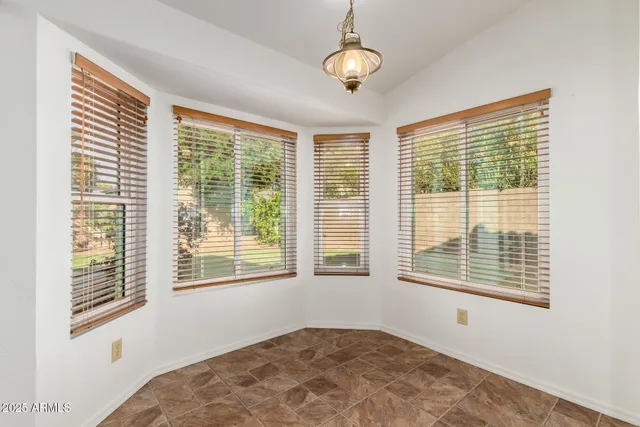 a view of a bedroom with windows