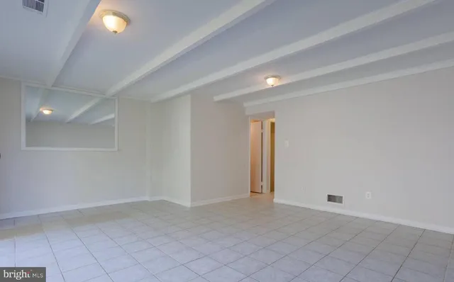 a kitchen with granite countertop a sink a stove and cabinets