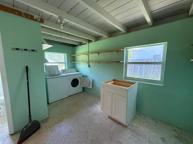 a utility room with dryer and washer