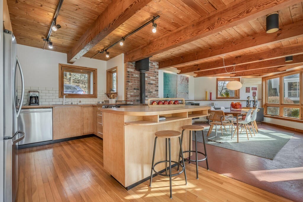 4 John-Wilson Lane Lexington, MA 02421 - Photo 11 of 39 a kitchen with stainless steel appliances granite countertop a stove a sink dishwasher and a refrigerator with wooden floor