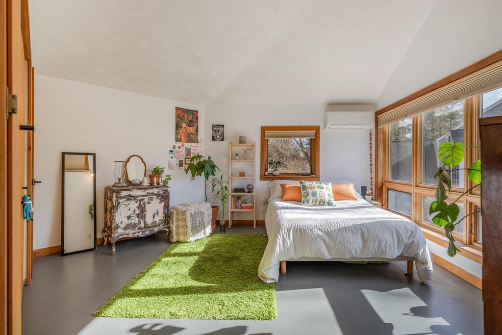 4 John-Wilson Lane Lexington, MA 02421 - Photo 23 of 39 a bedroom with a bed table and a flat tv screen