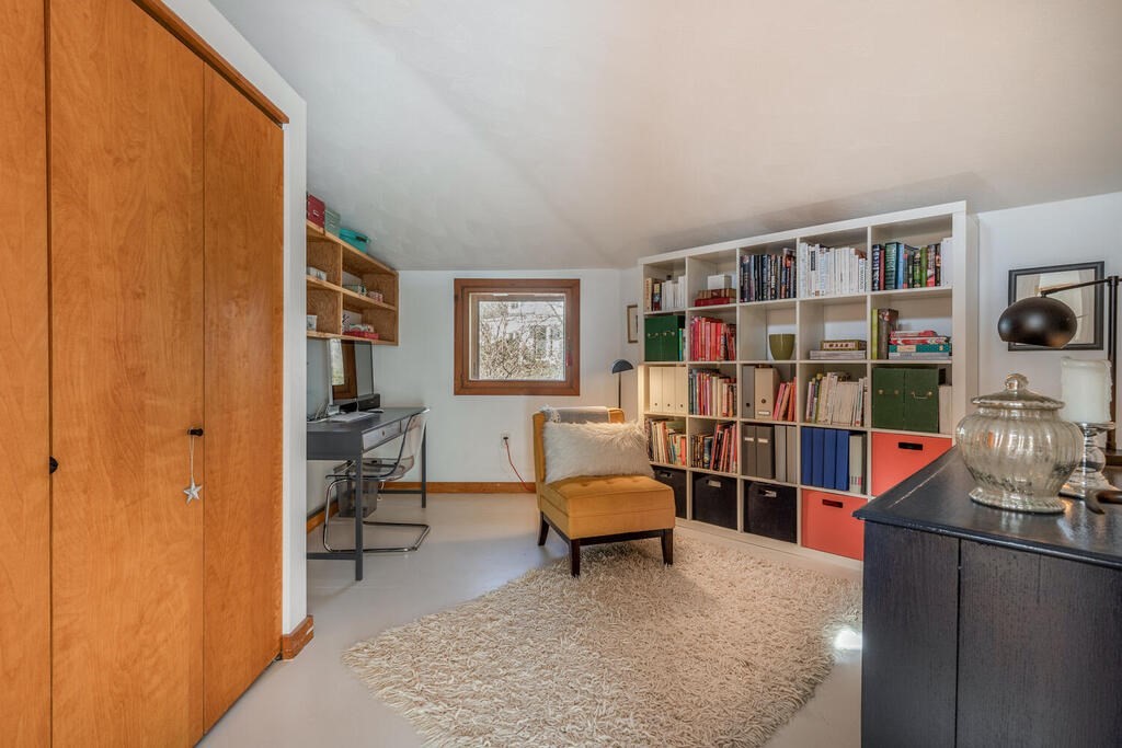 4 John-Wilson Lane Lexington, MA 02421 - Photo 25 of 39 a room with furniture a rug and a book shelf