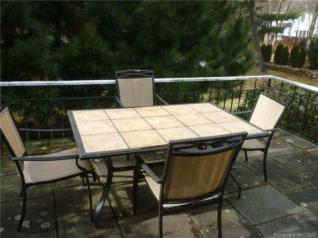927 Burroughs Road Fairfield, CT 06825 - Photo 14 of 33 a view of balcony with table and chairs