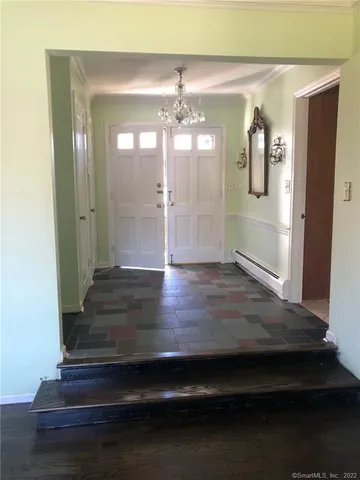 a view of gallery with wooden floor