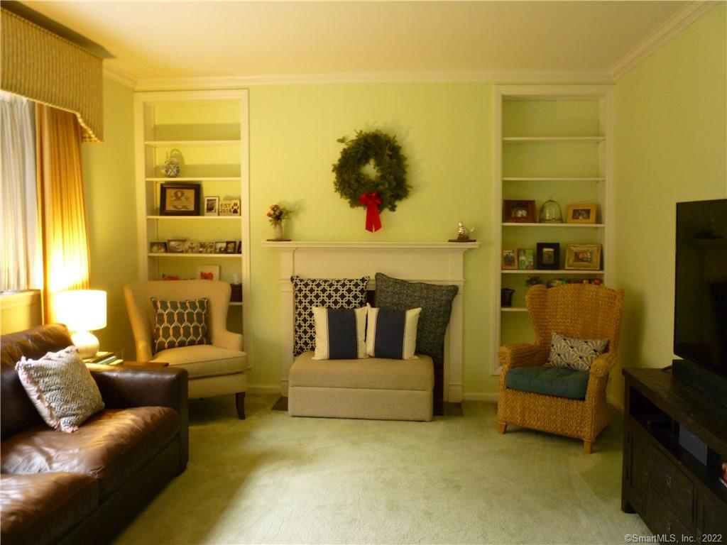 927 Burroughs Road Fairfield, CT 06825 - Photo 21 of 33 a living room with furniture and a flat screen tv
