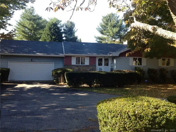a view of house with yard