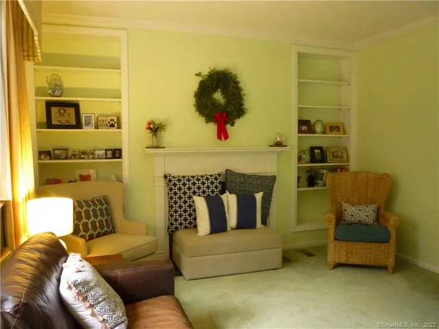 a view of a dining room with furniture and window
