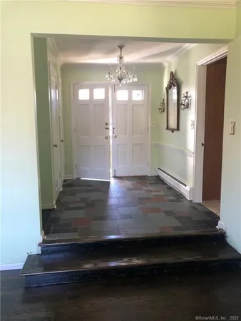 a view of gallery with wooden floor