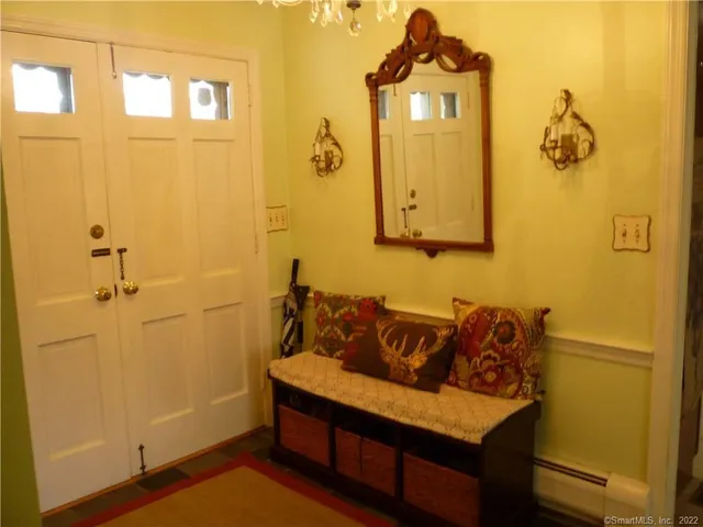 a bedroom with a bed and a lamp