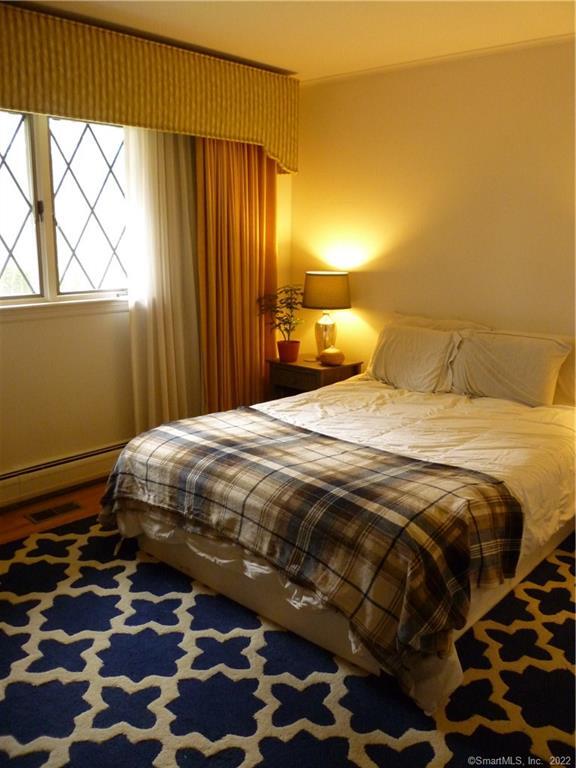 927 Burroughs Road Fairfield, CT 06825 - Photo 27 of 33 a bedroom with a bed and a window