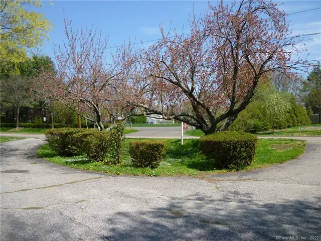 a view of house with yard