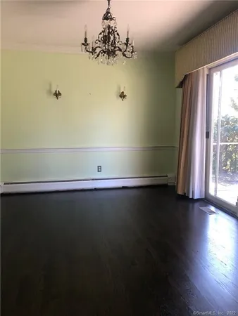 a view of room with window and hardwood floor