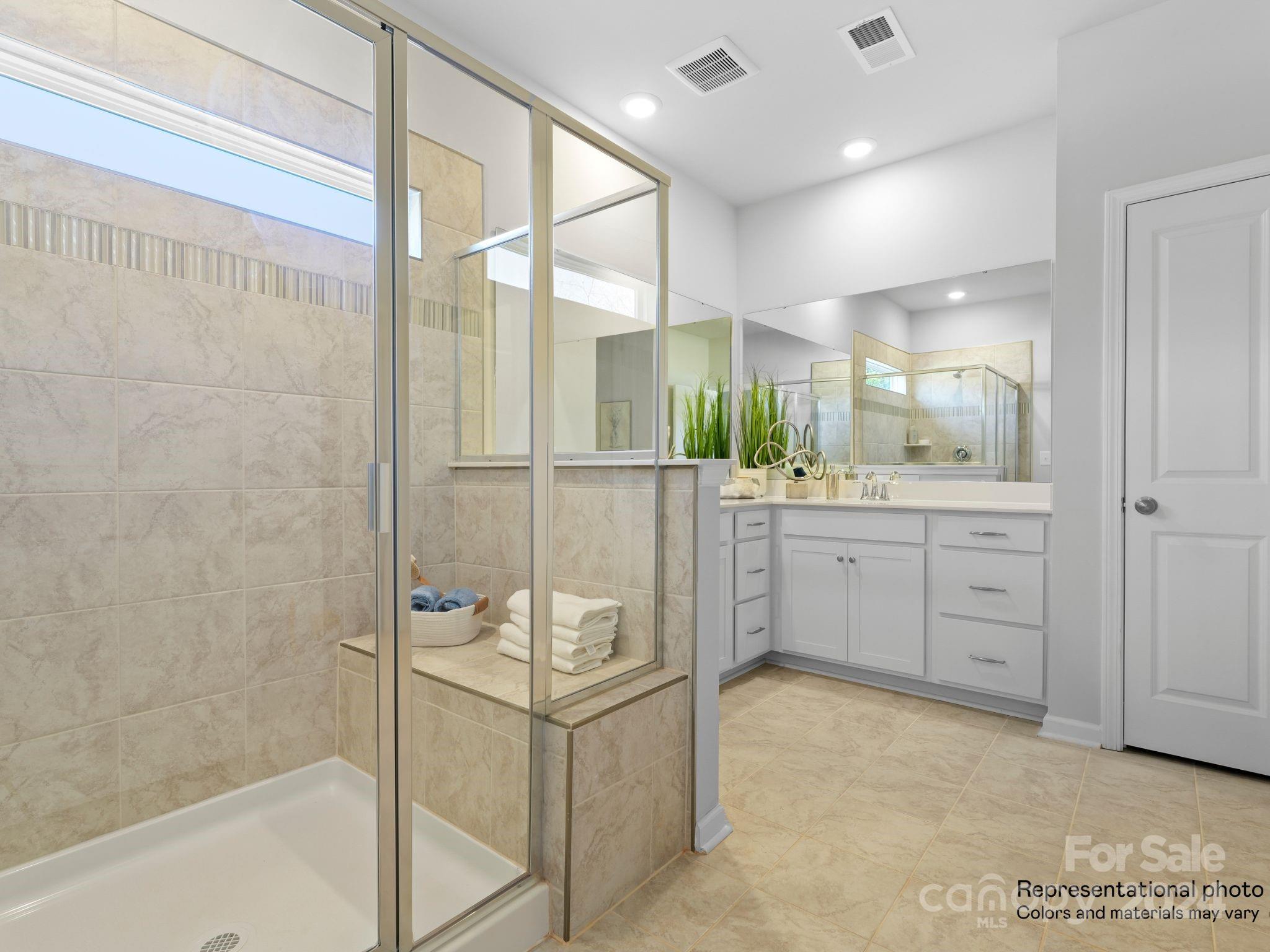 4451 Doyle Rdg Road Maiden, NC 28650 - Photo 16 of 21 a bathroom with a double vanity sink mirror and shower