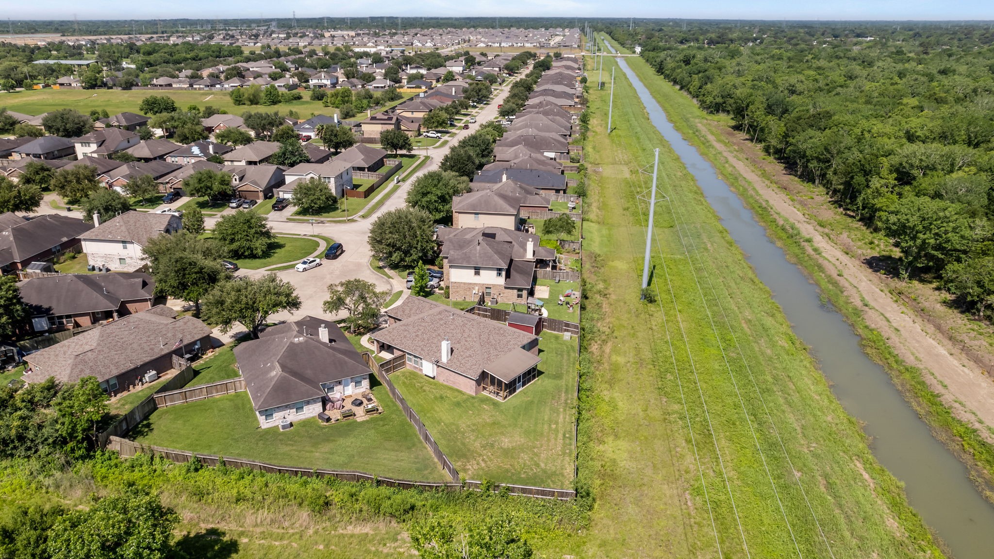 445 Decoster Boulevard Alvin, TX 77511 - Photo 30 of 32 Baclyard big enough for a pool or playset or garden or all of the above!!