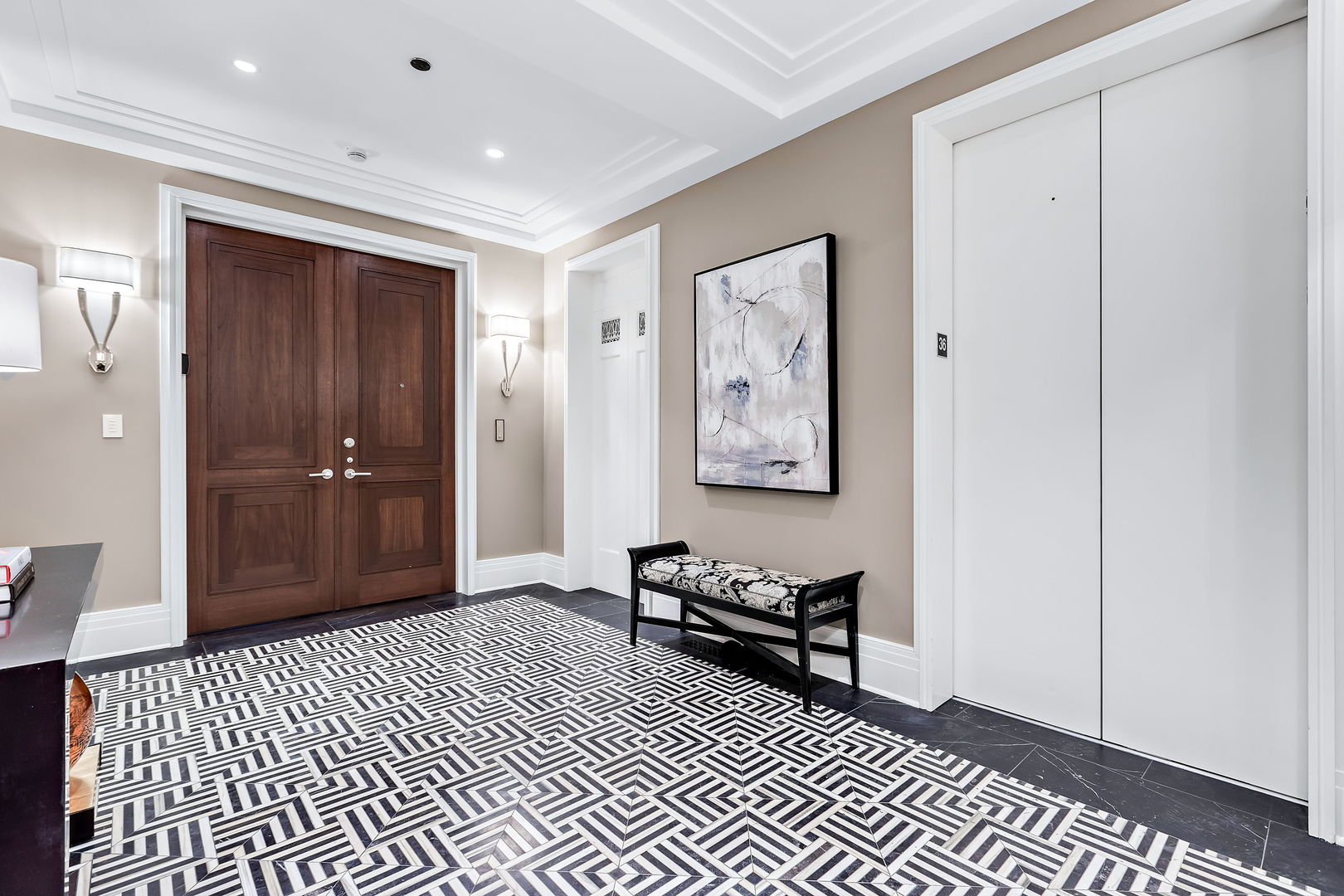 159 East Walton Place, Unit PH Chicago, IL 60611 - Photo 2 of 46 a view of a hallway with wooden floor and a bathroom