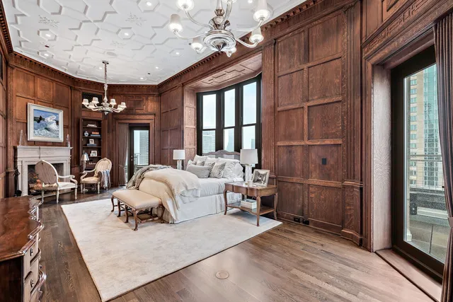 a view of a hallway with couch and chandelier