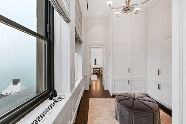 a en suite bathroom with a double vanity sink a mirror and a bathtub