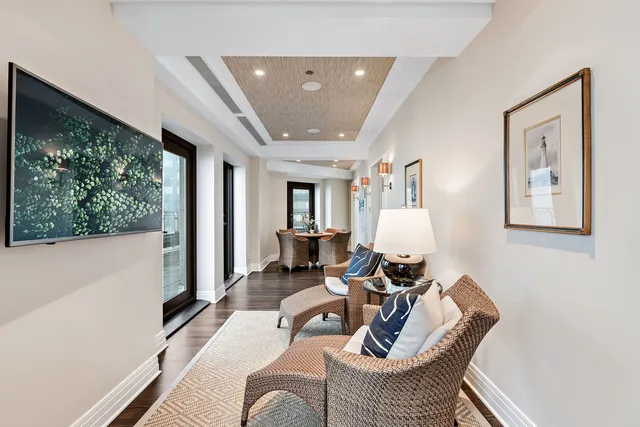 a kitchen with stainless steel appliances a white stove top oven a sink dishwasher and white cabinets with wooden floor