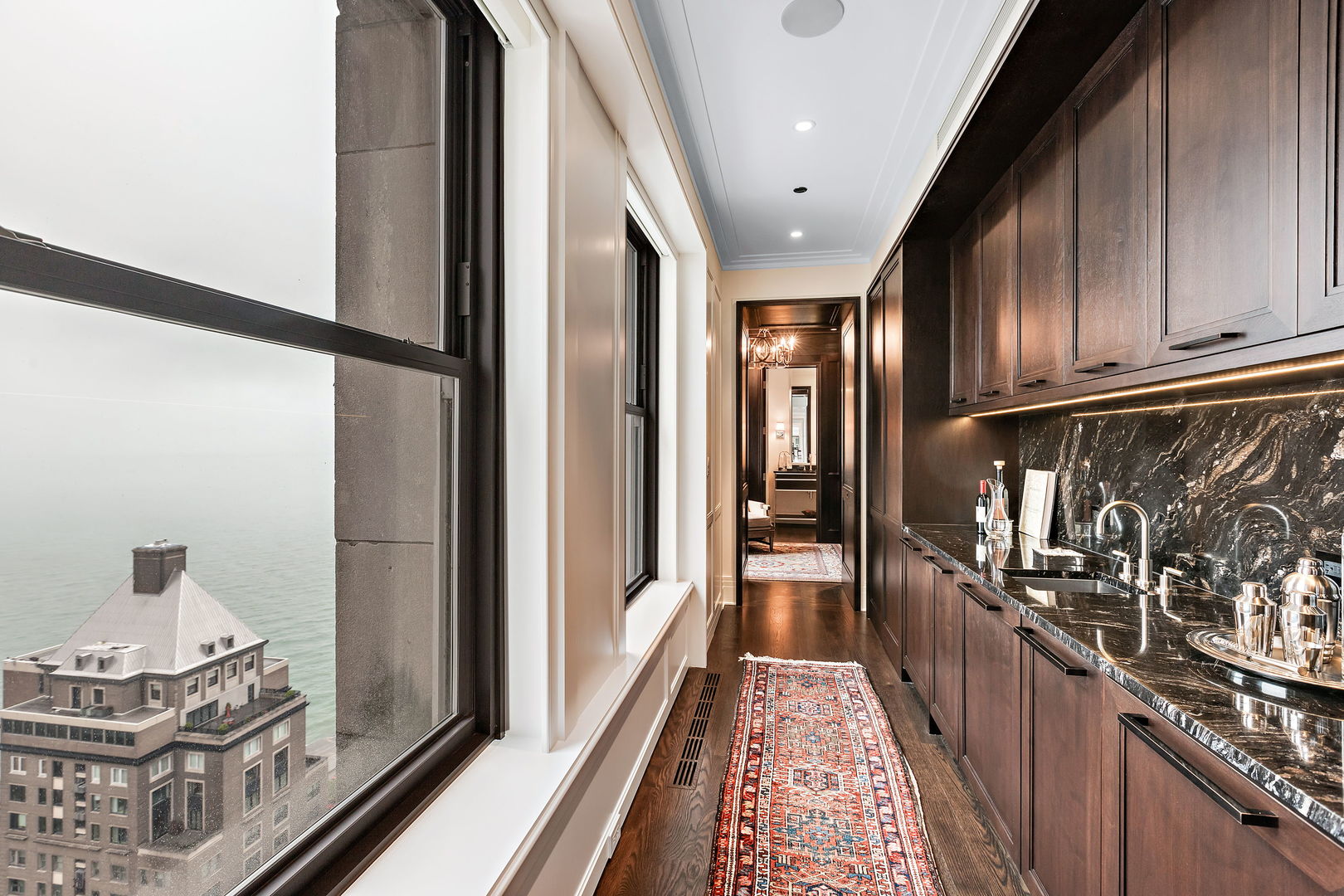 159 East Walton Place, Unit PH Chicago, IL 60611 - Photo 42 of 46 a view of a hallway with wooden floor