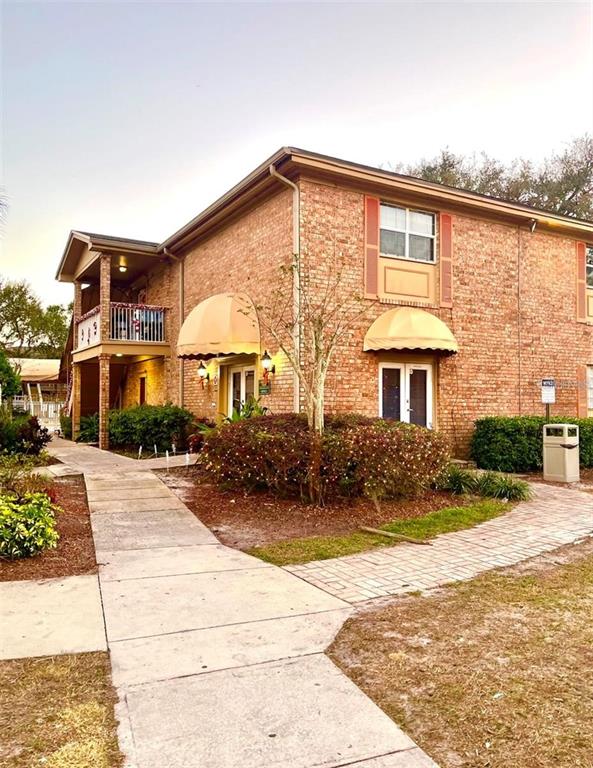 550 Flemming Way, Unit 200 Maitland, FL 32751 - Photo 8 of 11 a front view of a house with a yard