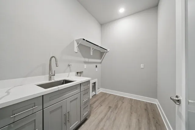 a kitchen with a sink and cabinets