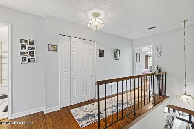 a view of a hallway with workspace