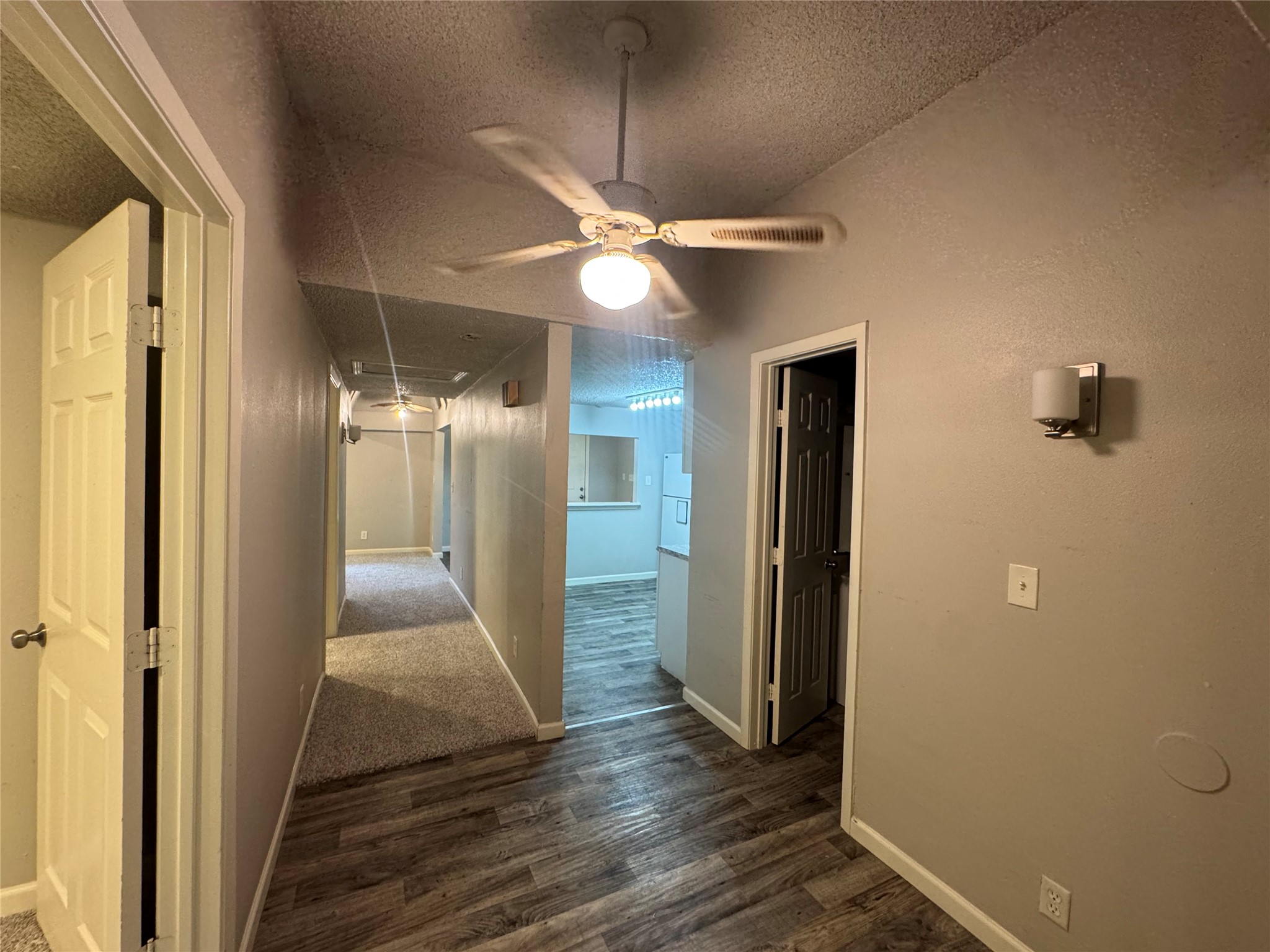 5007 Heflin Lane Austin, TX 78721 - Photo 10 of 25 Long, functional hallways connect distinct areas within the residence, offering a clear flow.