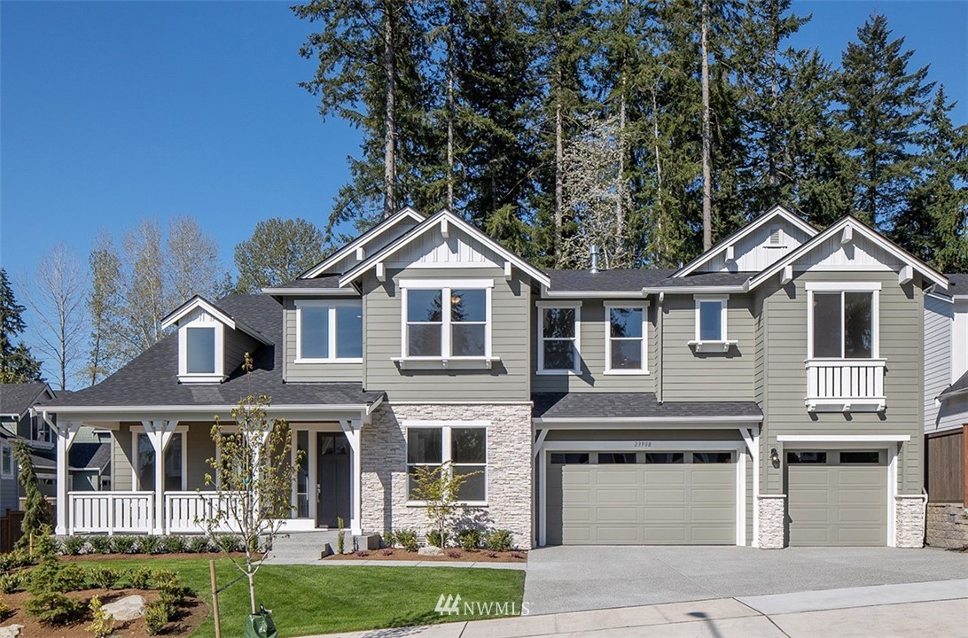 3010 230th Place Southeast Bothell, WA 98021 - Photo 1 of 17 a front view of a house with a yard