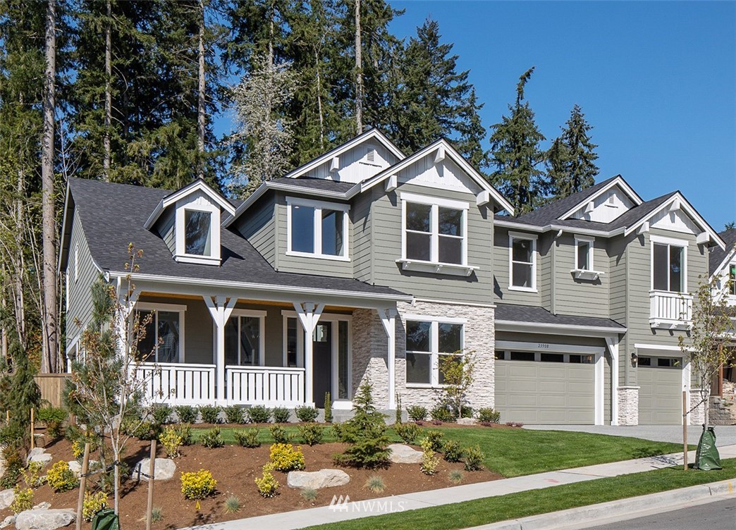 3010 230th Place Southeast Bothell, WA 98021 - Photo 2 of 17 a front view of a house with a yard