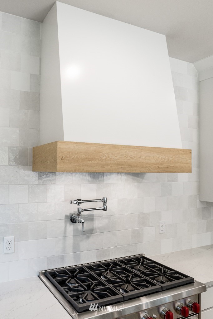 3010 230th Place Southeast Bothell, WA 98021 - Photo 6 of 17 a kitchen with a wooden floor and a stove