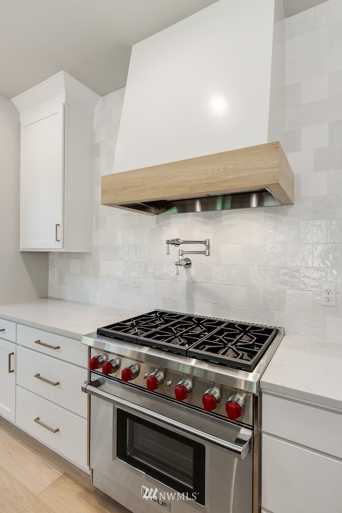 3010 230th Place Southeast Bothell, WA 98021 - Photo 7 of 17 a stove top oven sitting inside of a kitchen