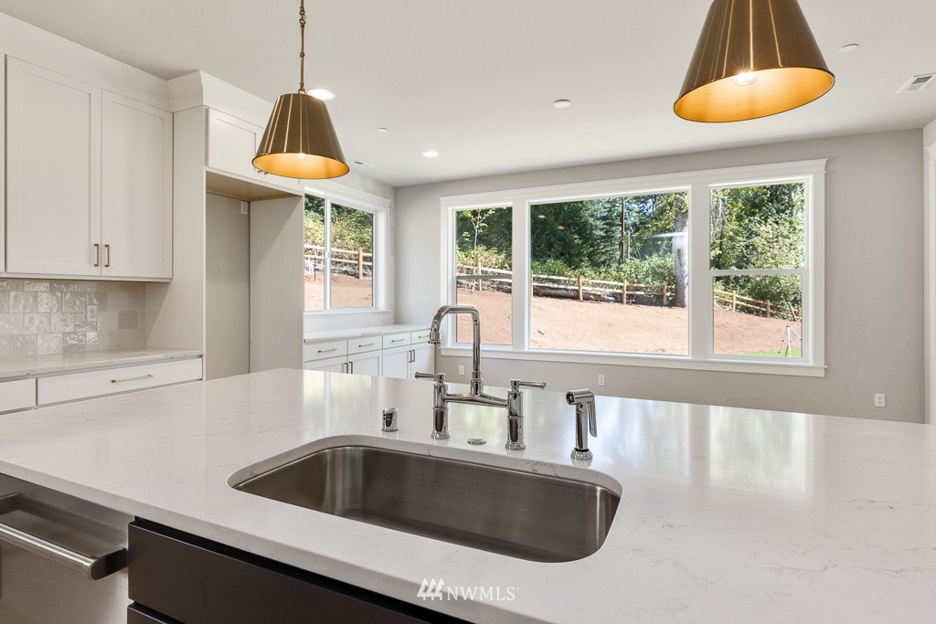 3010 230th Place Southeast Bothell, WA 98021 - Photo 9 of 17 a kitchen with a sink and a window