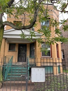 3516 West Polk Street Chicago, IL 60624 - Photo 1 of 9 a view of a house with a iron gate