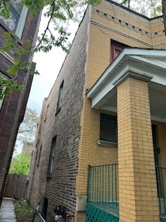 3516 West Polk Street Chicago, IL 60624 - Photo 2 of 9 a front view of a house with a garage