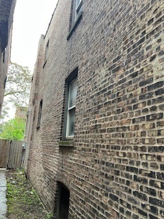 3516 West Polk Street Chicago, IL 60624 - Photo 3 of 9 a brick building with a door