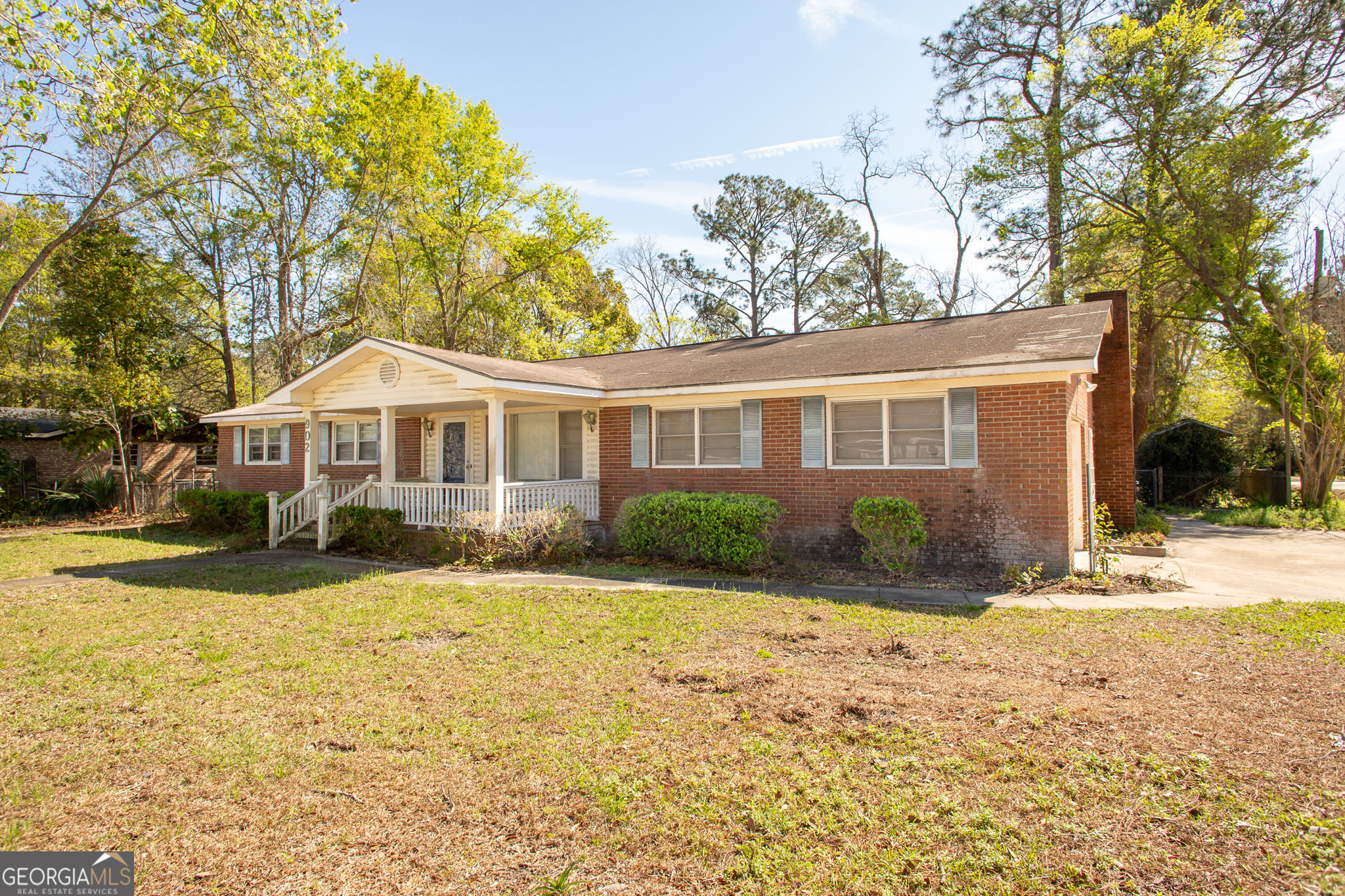 902 Stanton Avenue Waycross, GA 31503 - Photo 1 of 38 a front view of a house with a yard and garage
