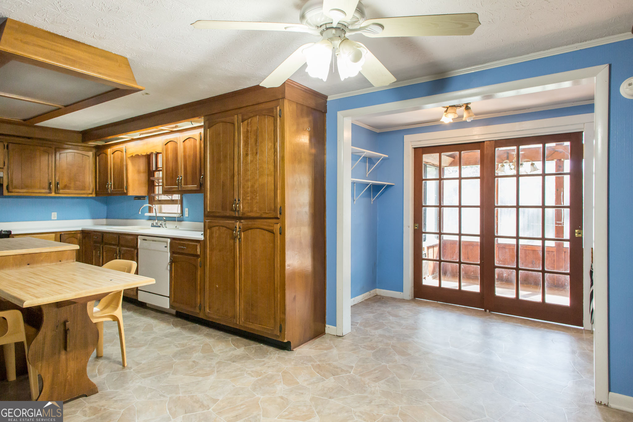 902 Stanton Avenue Waycross, GA 31503 - Photo 15 of 38 a view of a kitchen with furniture and a ceiling fan