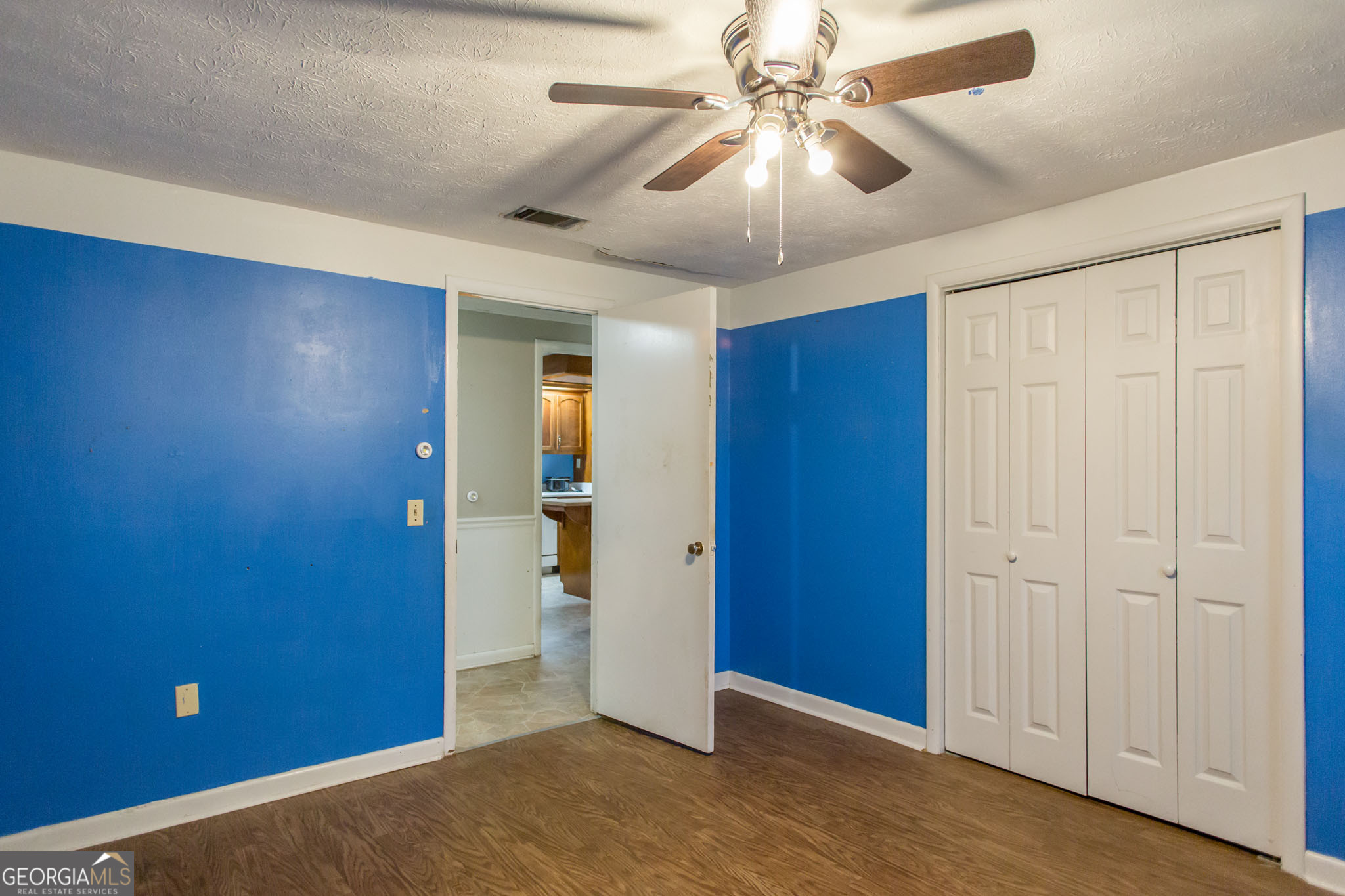 902 Stanton Avenue Waycross, GA 31503 - Photo 27 of 38 wooden floor in an empty room