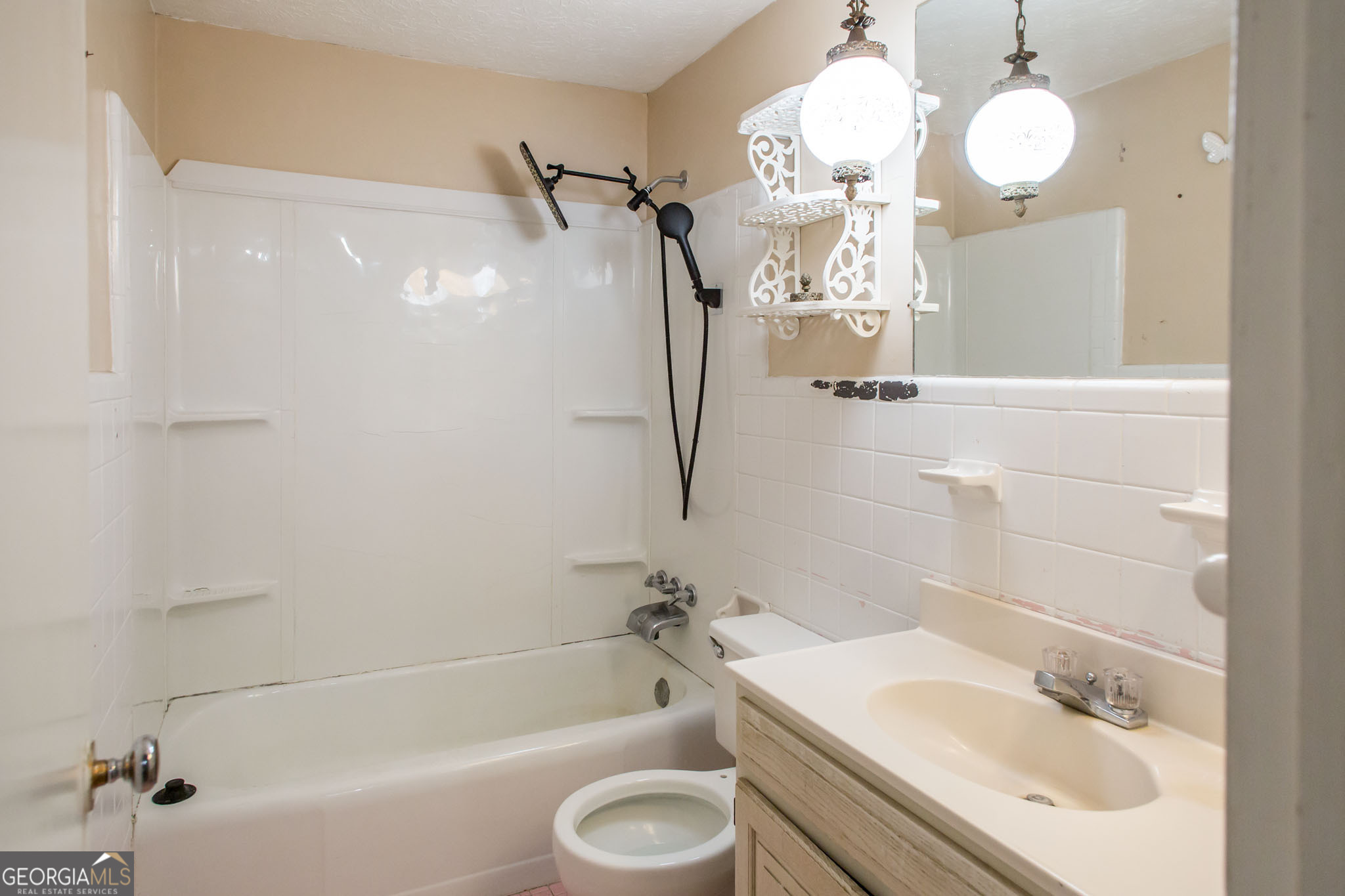 902 Stanton Avenue Waycross, GA 31503 - Photo 28 of 38 a bathroom with a sink a toilet and shower