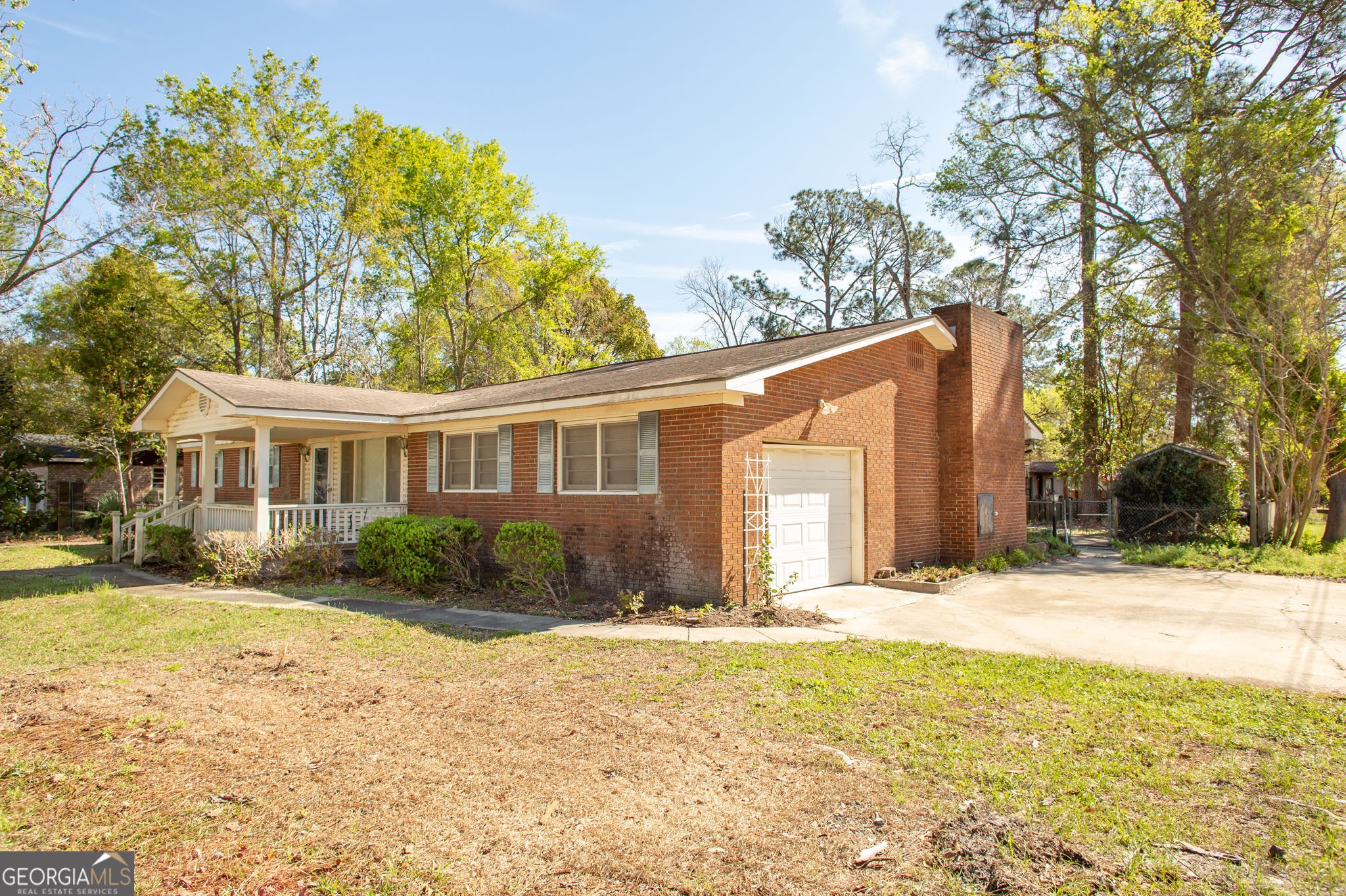 902 Stanton Avenue Waycross, GA 31503 - Photo 3 of 38 a front view of a house with a yard and trees