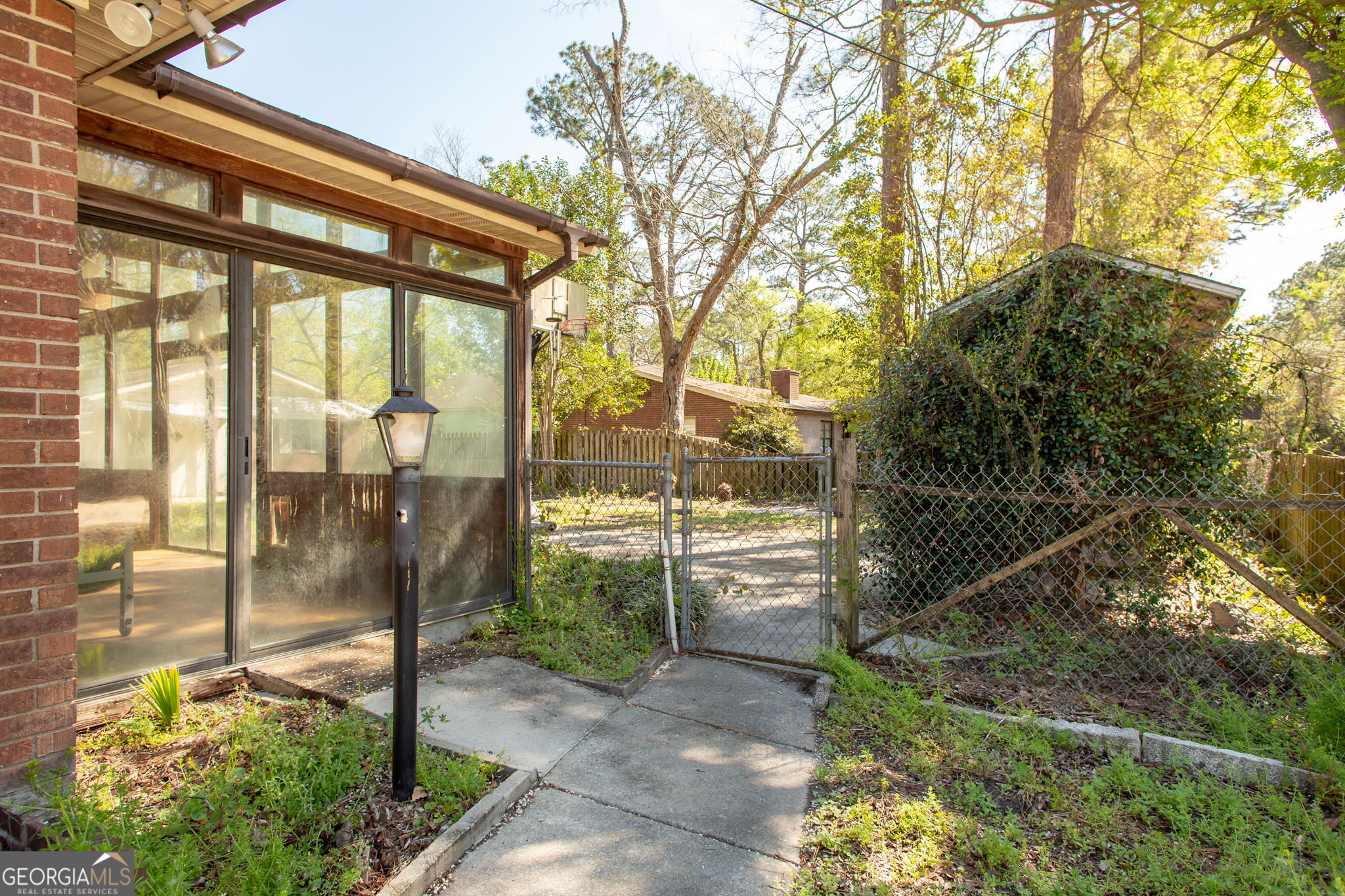 902 Stanton Avenue Waycross, GA 31503 - Photo 5 of 38 a front view of a house with a garden