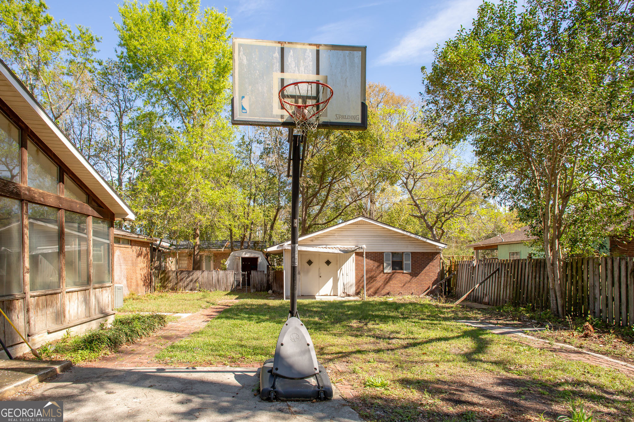 902 Stanton Avenue Waycross, GA 31503 - Photo 7 of 38 a small pool with a trees in the background