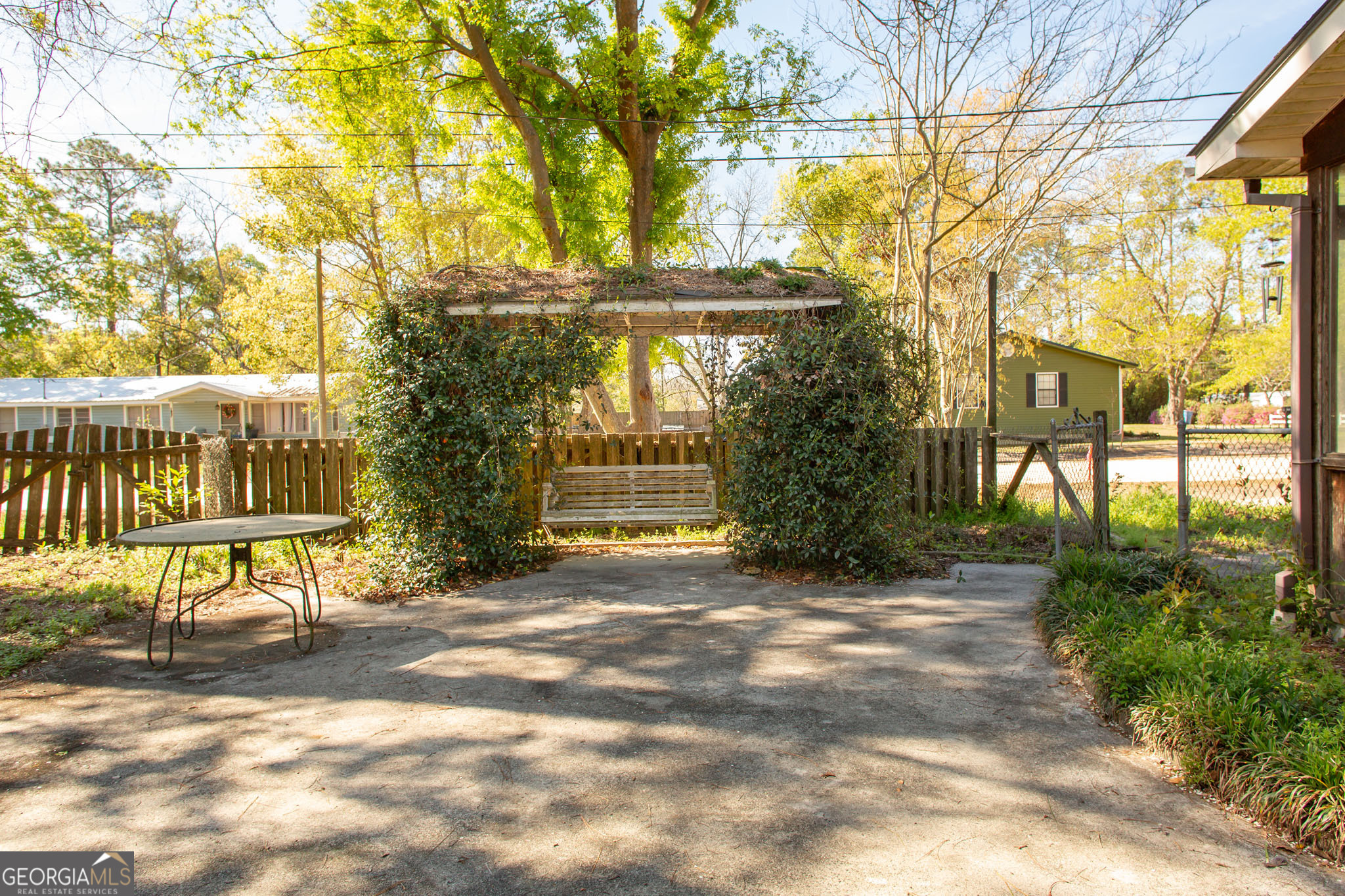 902 Stanton Avenue Waycross, GA 31503 - Photo 8 of 38 a view of a house with a yard and sitting area