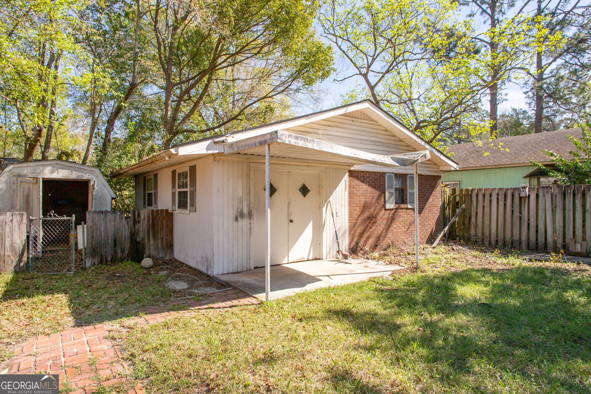 902 Stanton Avenue Waycross, GA 31503 - Photo 9 of 38 a house with trees in the background