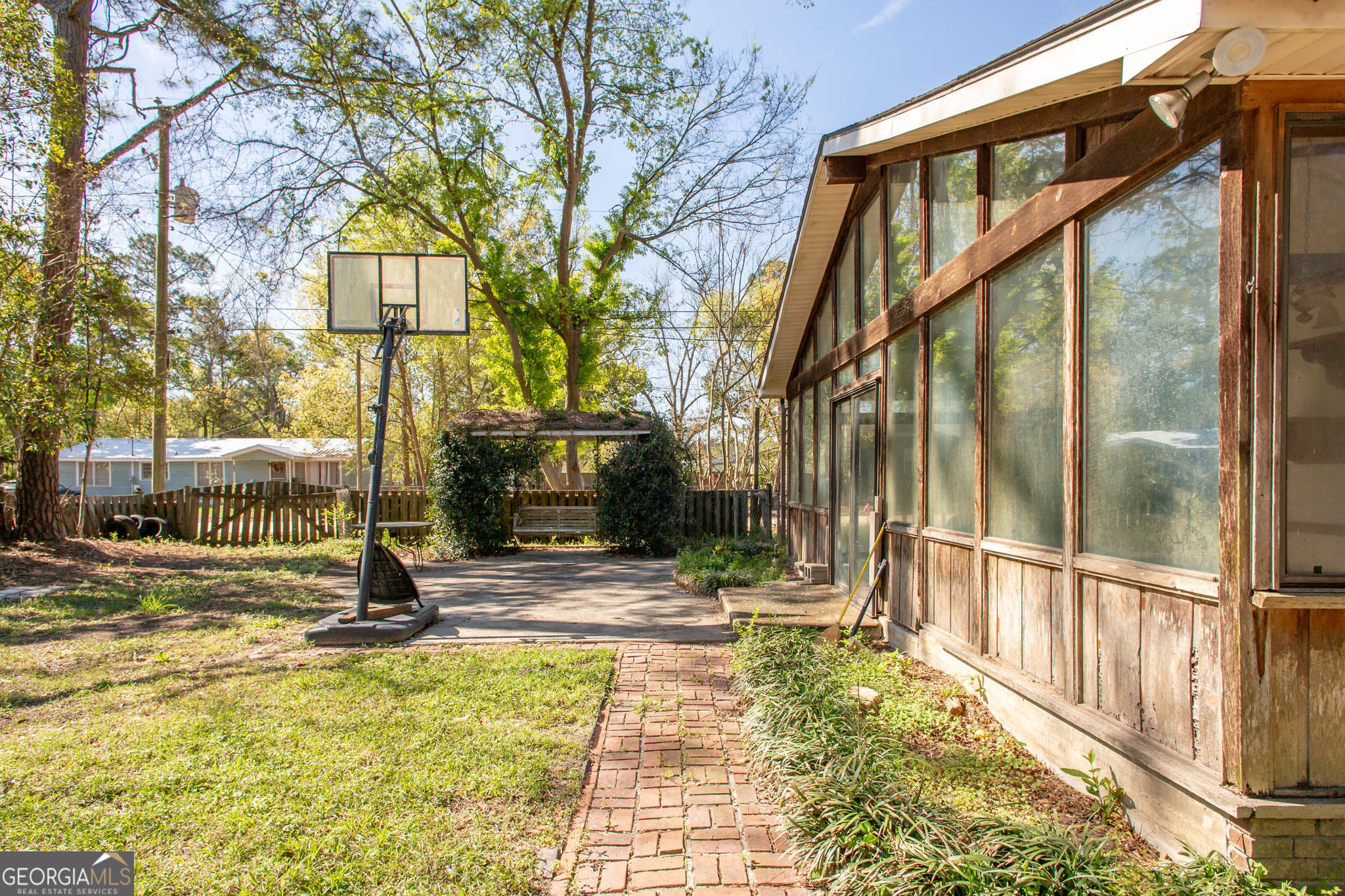 902 Stanton Avenue Waycross, GA 31503 - Photo 10 of 38 a view of a pathway of a house with a backyard